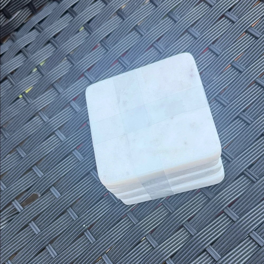 Stack of White Square Marble Coasters